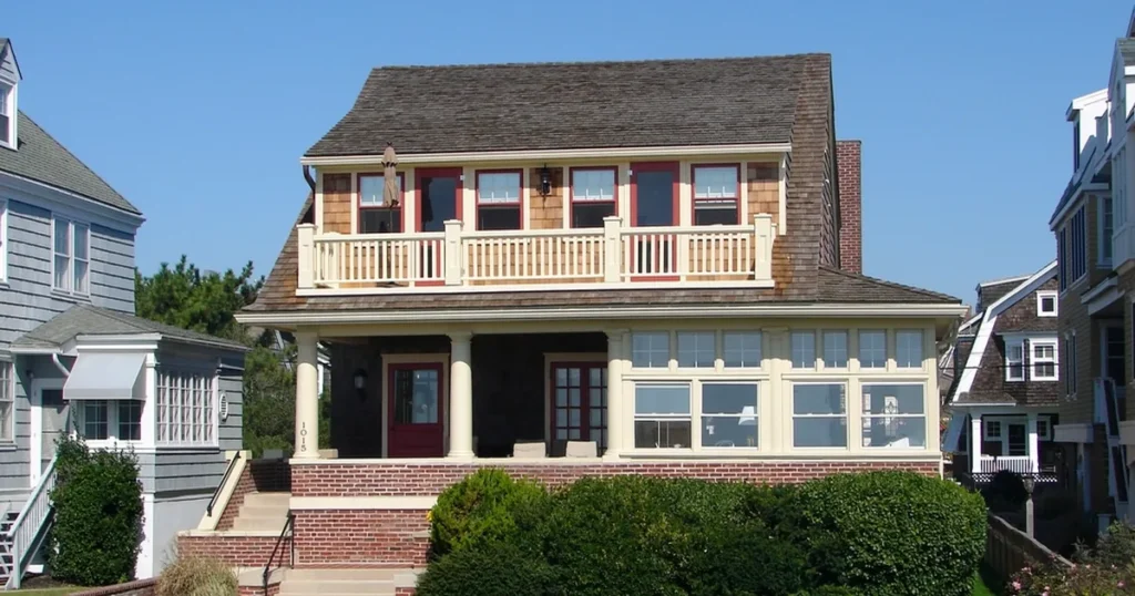 Two-story house with front shrubs and brick steps, the kind of property where owners ask: is cost segregation worth it?