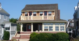 Two-story house with front shrubs and brick steps, the kind of property where owners ask: is cost segregation worth it?